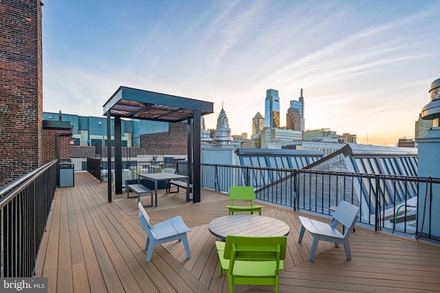 wooden deck with a city view