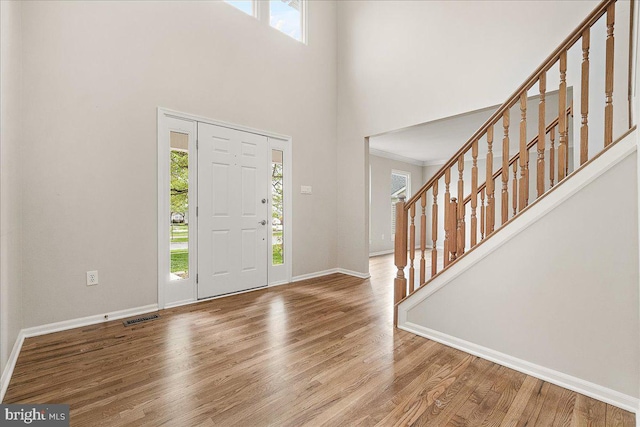 5342 Saint James Pl, Frederick, MD 21703 - foyer entrance with stairway, visible vents, wood finished floors, and baseboards
