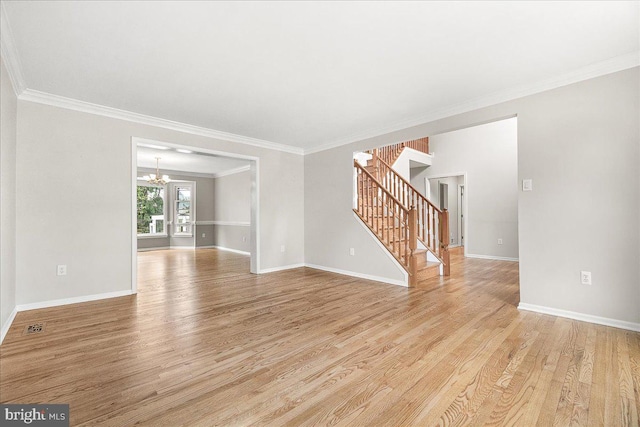 5342 Saint James Pl, Frederick, MD 21703 - unfurnished living room with light wood finished floors, ornamental molding, a notable chandelier, and stairs