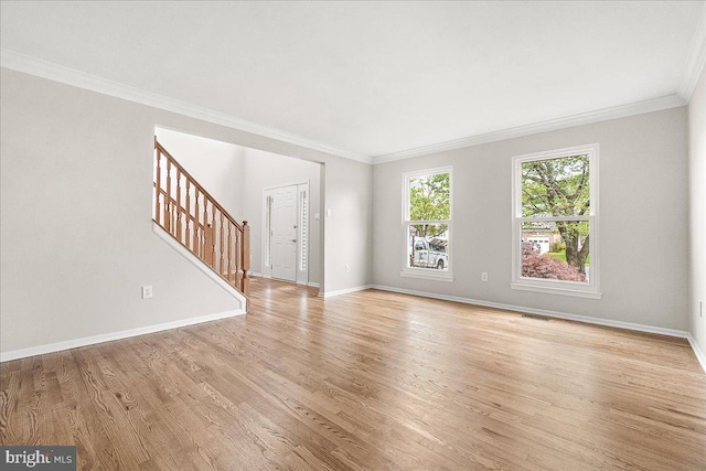 5342 Saint James Pl, Frederick, MD 21703 - unfurnished living room featuring visible vents, light wood-type flooring, baseboards, stairway, and crown molding