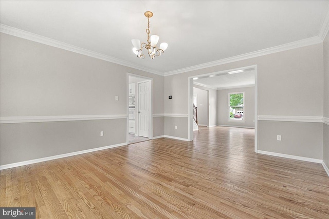5342 Saint James Pl, Frederick, MD 21703 - spare room featuring ornamental molding, light wood finished floors, and a notable chandelier