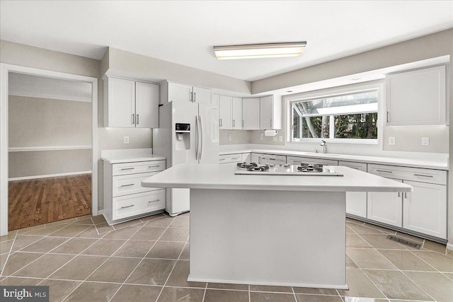 5342 Saint James Pl, Frederick, MD 21703 - kitchen featuring light tile patterned flooring, visible vents, white appliances, and light countertops