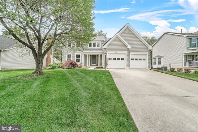 5342 Saint James Pl, Frederick, MD 21703 - view of front of home with a front yard, concrete driveway, central air condition unit, and an attached garage