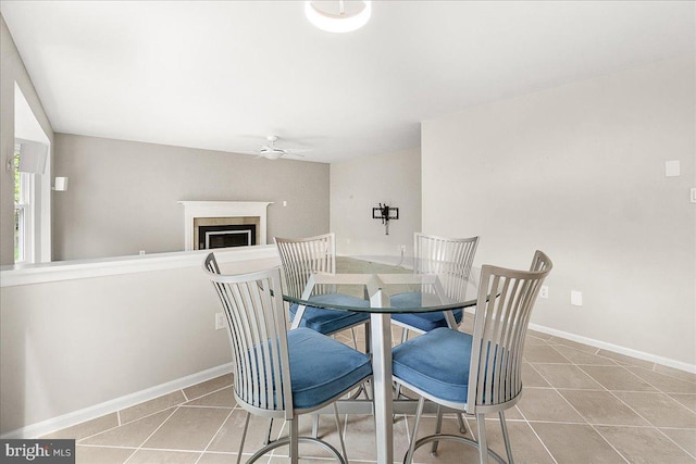 5342 Saint James Pl, Frederick, MD 21703 - tiled dining room with ceiling fan, baseboards, and a fireplace