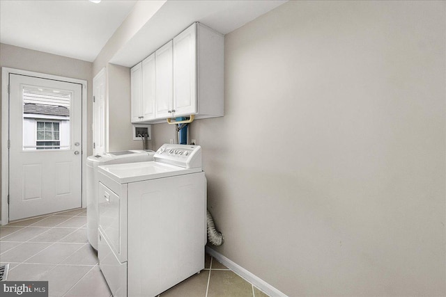 5342 Saint James Pl, Frederick, MD 21703 - laundry area featuring light tile patterned floors, cabinet space, baseboards, and washer and clothes dryer
