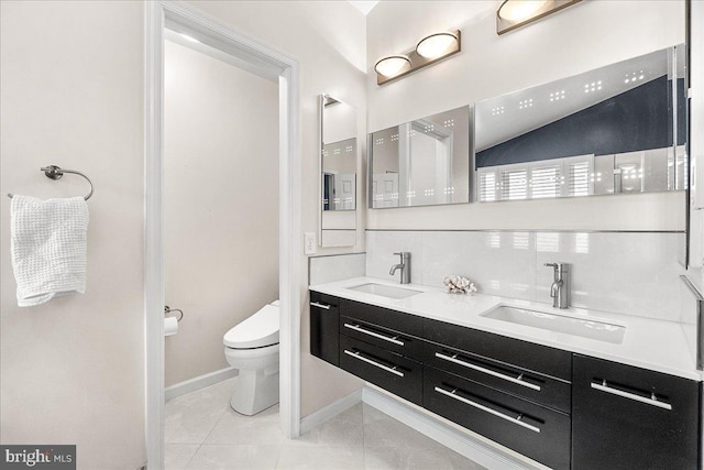 5342 Saint James Pl, Frederick, MD 21703 - bathroom with baseboards, toilet, double vanity, and a sink