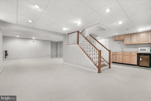 5342 Saint James Pl, Frederick, MD 21703 - finished below grade area with a sink, baseboards, light carpet, wine cooler, and stairs