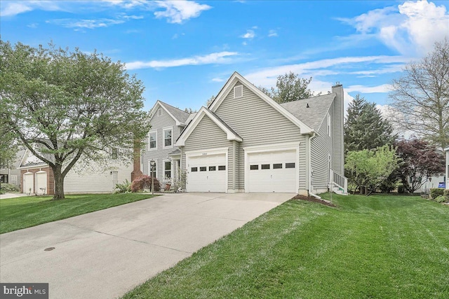 5342 Saint James Pl, Frederick, MD 21703 - view of front of property with a front yard, driveway, an attached garage, and a chimney