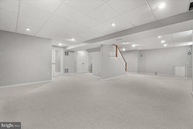 5342 Saint James Pl, Frederick, MD 21703 - finished below grade area with stairway, visible vents, and light carpet