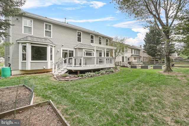 5342 Saint James Pl, Frederick, MD 21703 - rear view of house featuring fence, a wooden deck, a yard, and a garden