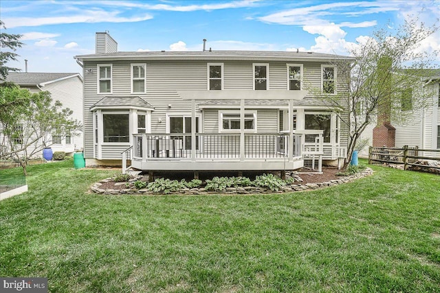 5342 Saint James Pl, Frederick, MD 21703 - back of property featuring a wooden deck, a yard, fence, and a chimney
