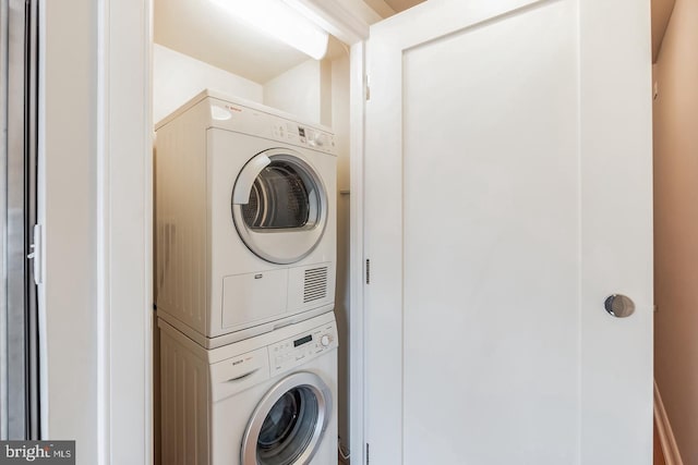 1111 19th St N Unit 1804, Arlington, VA 22209 - clothes washing area featuring stacked washer / drying machine and laundry area