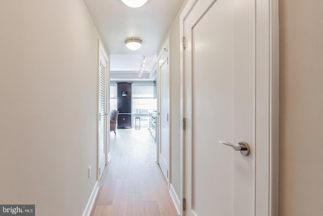 1111 19th St N Unit 1804, Arlington, VA 22209 - hallway featuring baseboards and light wood finished floors