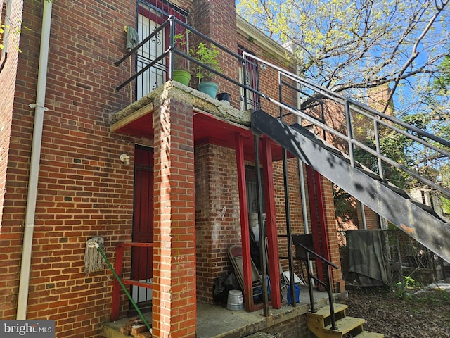 view of side of home with brick siding