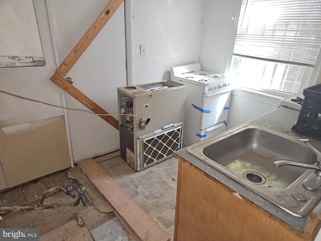 interior space featuring a sink and washer / clothes dryer