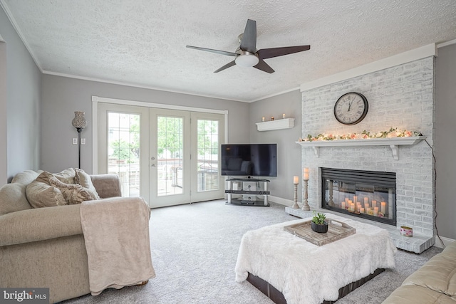 619 Walden Way, Lumberton, NJ 08048 - carpeted living area with ceiling fan, a brick fireplace, a textured ceiling, and ornamental molding