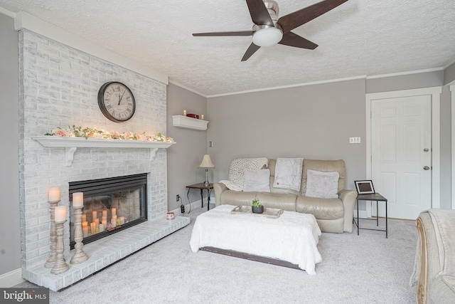 619 Walden Way, Lumberton, NJ 08048 - living area featuring ceiling fan, a textured ceiling, a brick fireplace, carpet flooring, and crown molding
