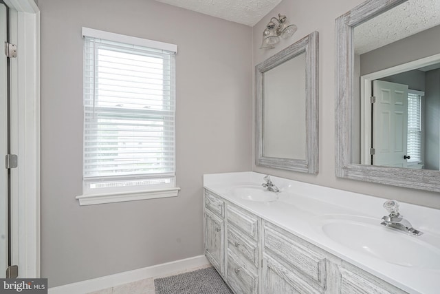619 Walden Way, Lumberton, NJ 08048 - full bathroom with a textured ceiling, double vanity, tile patterned floors, and baseboards