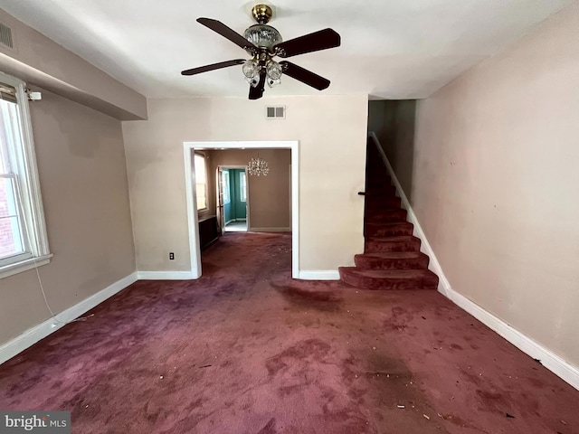 721 Tuckerman St NW, Washington, DC 20011 - unfurnished living room with ceiling fan, stairway, visible vents, and a healthy amount of sunlight