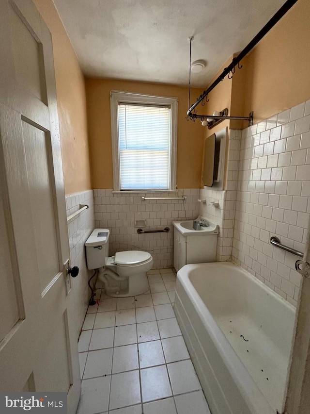 721 Tuckerman St NW, Washington, DC 20011 - bathroom featuring tile walls, vanity, toilet, tile patterned flooring, and wainscoting