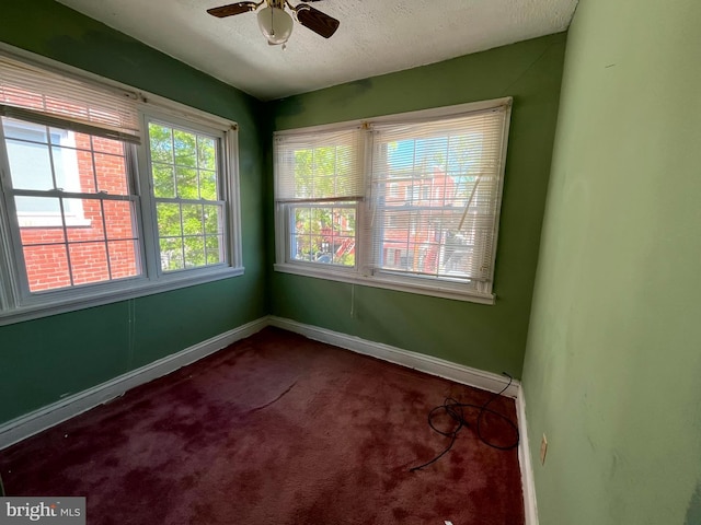 721 Tuckerman St NW, Washington, DC 20011 - spare room featuring baseboards, a ceiling fan, a textured ceiling, and carpet