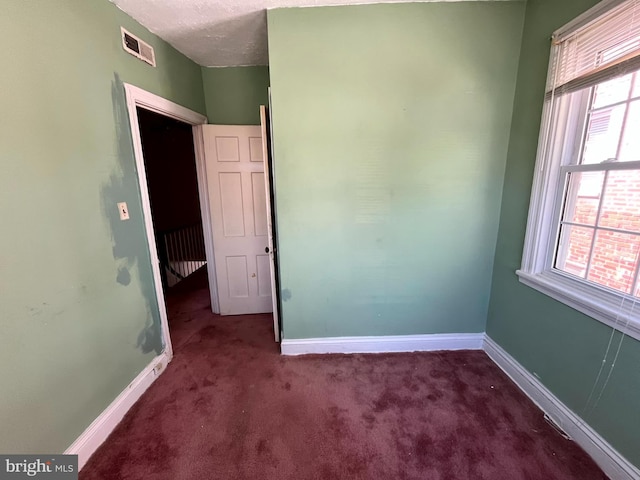 721 Tuckerman St NW, Washington, DC 20011 - unfurnished room featuring visible vents, carpet flooring, and baseboards