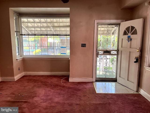 721 Tuckerman St NW, Washington, DC 20011 - entryway featuring tile patterned flooring, carpet floors, and baseboards