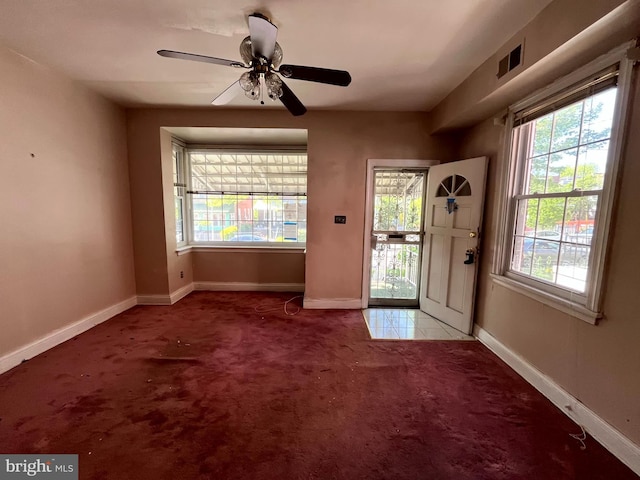 721 Tuckerman St NW, Washington, DC 20011 - doorway featuring a ceiling fan, visible vents, carpet floors, and baseboards