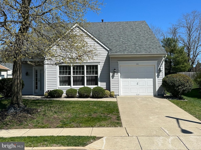 39 Sunset Ln, Columbus, NJ 08022 - view of front facade featuring concrete driveway, an attached garage, a front lawn, and roof with shingles