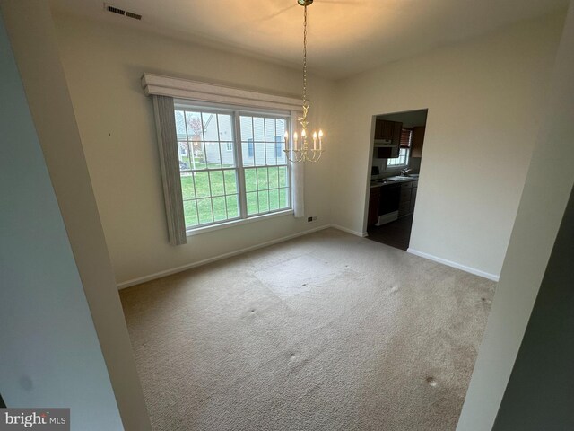 39 Sunset Ln, Columbus, NJ 08022 - unfurnished dining area with a chandelier, visible vents, baseboards, and carpet floors