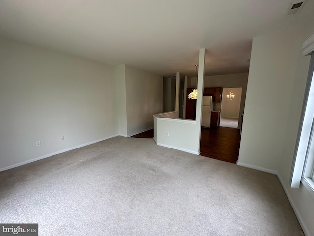 39 Sunset Ln, Columbus, NJ 08022 - unfurnished room with carpet flooring, visible vents, baseboards, and an inviting chandelier