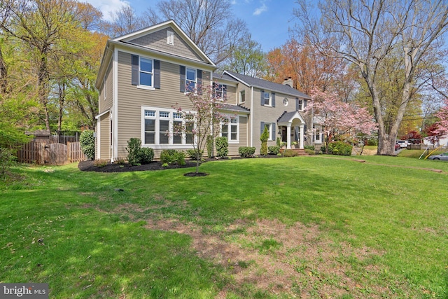 221 Williamsburg Dr, Silver Spring, MD 20901 - view of front facade with a front lawn and fence