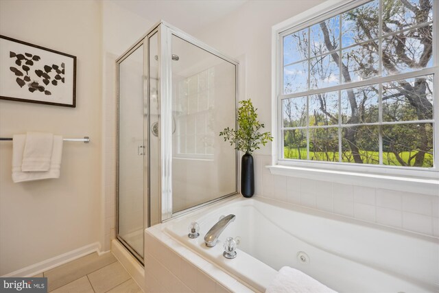 13416 Ansel Ter, Germantown, MD 20874 - full bathroom with tile patterned floors, a tub with jets, baseboards, and a stall shower