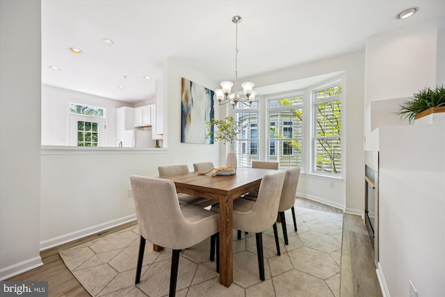 13416 Ansel Ter, Germantown, MD 20874 - dining room with an inviting chandelier, recessed lighting, baseboards, and light wood-style flooring