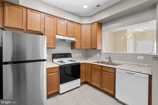 kitchen featuring visible vents, dishwasher, freestanding refrigerator, electric stove, and under cabinet range hood