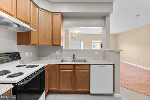 kitchen featuring a notable chandelier, under cabinet range hood, electric stove, dishwasher, and a sink