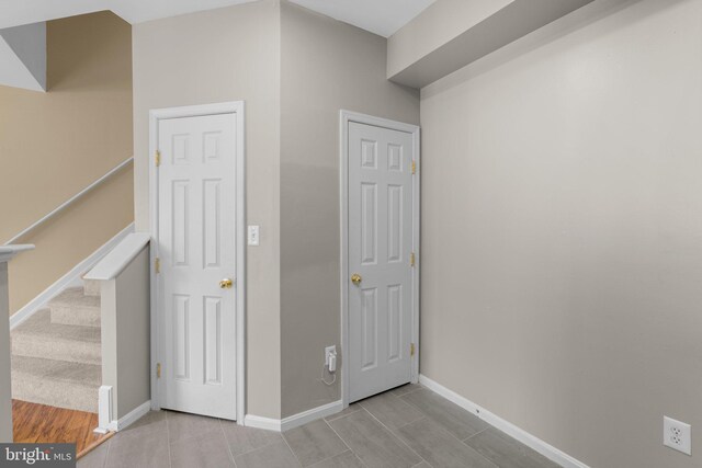 interior space featuring baseboards