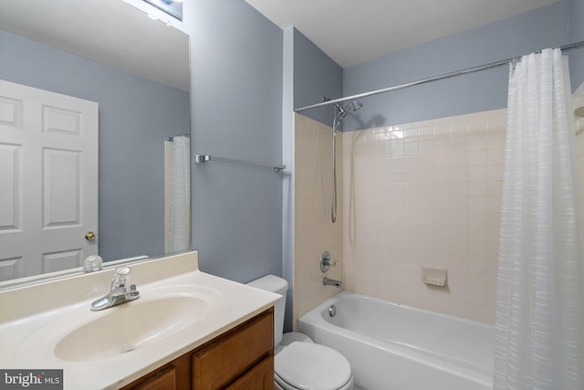 bathroom featuring shower / bath combo, toilet, and vanity