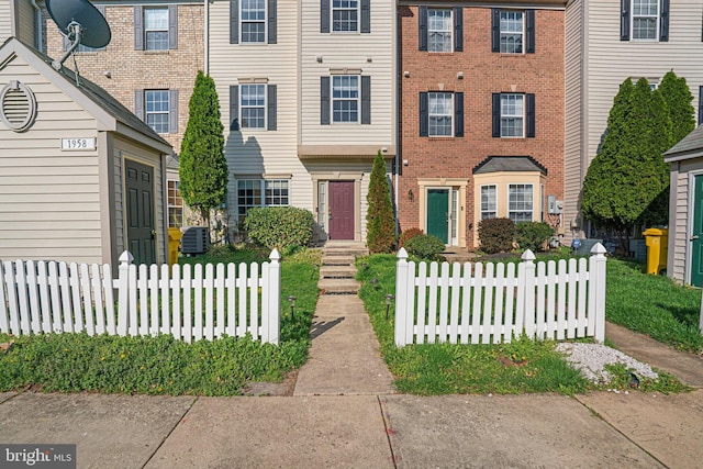 multi unit property featuring central AC and fence