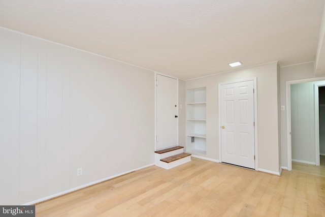 4803 30th St S Unit A2, Arlington, VA 22206 - unfurnished bedroom featuring light wood finished floors and a textured ceiling