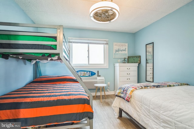 bedroom with wood finished floors