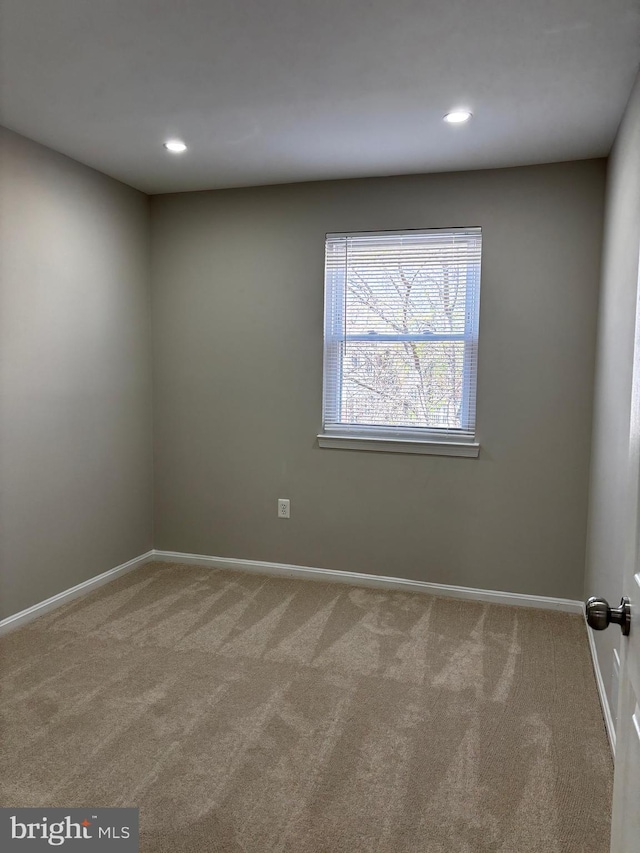 carpeted empty room with recessed lighting and baseboards