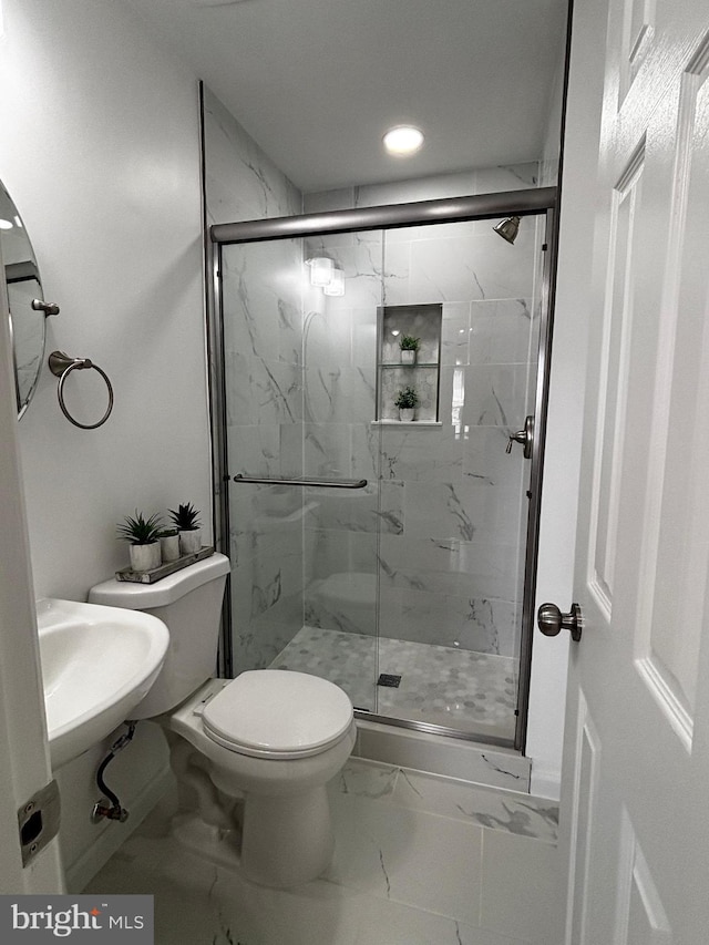 full bathroom with a sink, a marble finish shower, marble finish floor, toilet, and recessed lighting