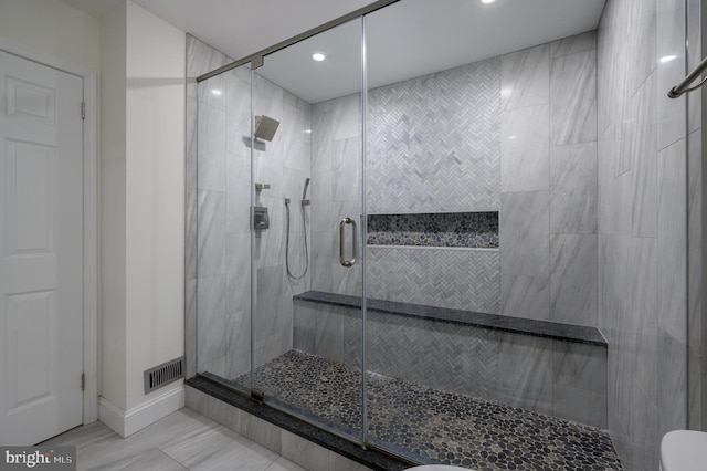 full bathroom featuring recessed lighting, baseboards, visible vents, and a stall shower