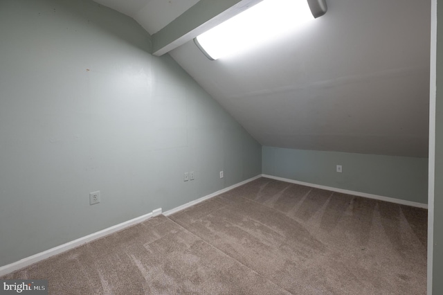 bonus room featuring baseboards, carpet, and lofted ceiling