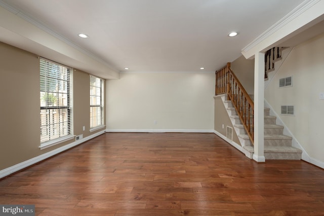 spare room with ornamental molding, recessed lighting, and visible vents