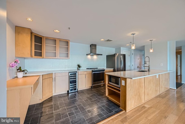 250 President St Unit 1001, Baltimore, MD 21202 - kitchen featuring a sink, stainless steel appliances, wine cooler, wall chimney exhaust hood, and light brown cabinetry