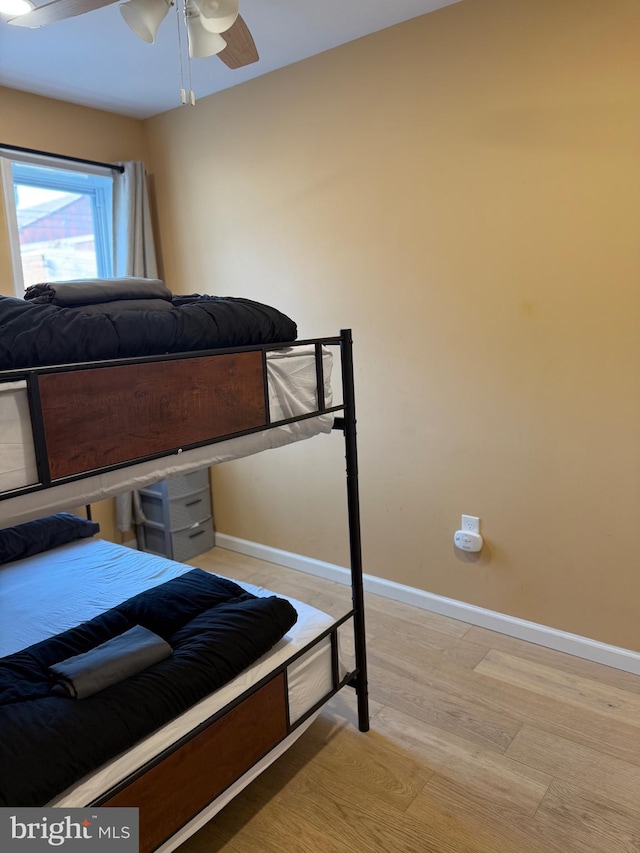 bedroom with baseboards and ceiling fan