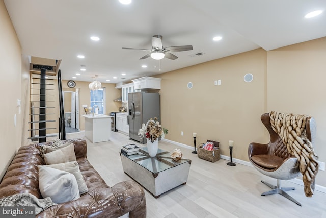 living area with visible vents, recessed lighting, and a ceiling fan