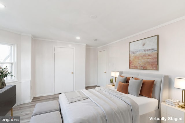 bedroom featuring light wood finished floors, baseboards, ornamental molding, and recessed lighting
